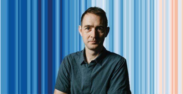 Ed Hawkins in front of the climate stripes