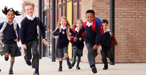 Schoolchildren running along a path