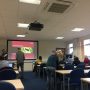 Colleagues taking their seats at the December Mince Pie briefing.