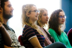 A group of students engaging in teaching & learning