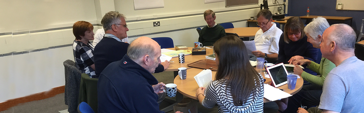 Several people attending a book club meeting.